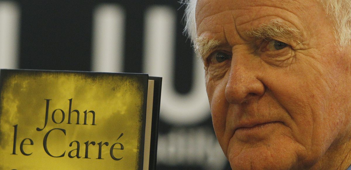 British author John le Carre holds a copy of his new book entitled 