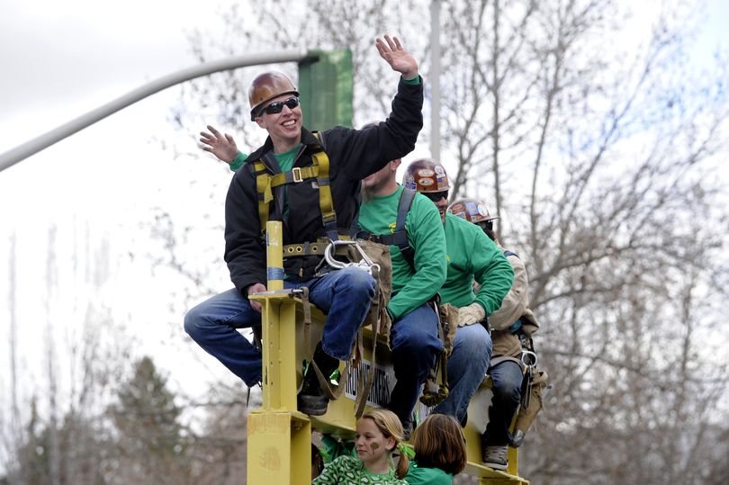 Mike Ulrick sits with other workers from the Ironworkers Local 14 as they ride their float through the St. Patrick's Day Parade Saturday, Mar. 13, 2010 in downtown Spokane. (Jesse Tinsley / The Spokesman-Review)