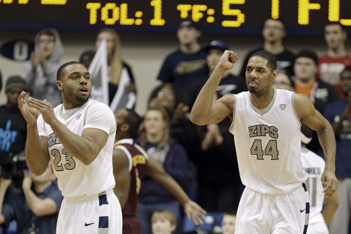 Seven-foot center Zeke Marshall, right, celebrates a play with Akron teammate Chauncey Gilliam. (Associated Press)