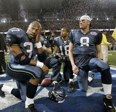 
Seahawks Shaun Alexander (37), D.J. Hackett (18) and Matt Hasselbeck watch the other side celebrate after losing 21-10 to the Pittsburgh Steelers in Sunday's Super Bowl.
 (Associated Press / The Spokesman-Review)
