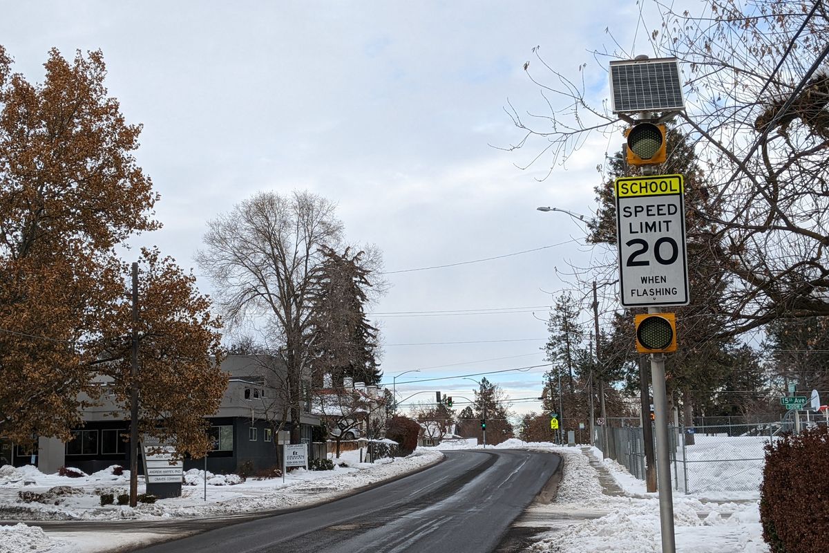 A beacon will flash to warn drivers headed northbound on South Bernard Street near Roosevelt Elementary to slow down during certain times when school is in session.  (Emry Dinman/The Spokesman-Review)