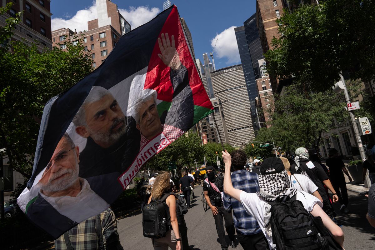 NEW YORK, NEW YORK - SEPTEMBER 2: A person holds a flag with an image of Yahya Sinwar as people attend a protest in support of the war in Gaza, on Labor Day on September 2, 2024 in New York City. Following the deaths of six hostages in Gaza, protestors demand that Israel reach a deal with Hamas. (Photo by Adam Gray/Getty Images)  (Adam Gray)