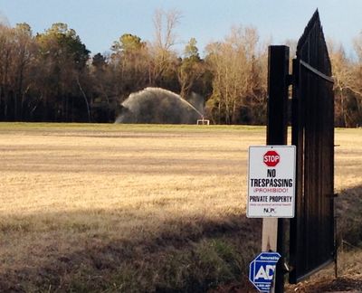 A sprayer soaks a field with liquefied manure and urine from a large-scale hog farm in Duplin County, N.C., in January. (Associated Press)