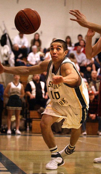 Shadle Park guard Leo Avila scrambles for a loose ball against North Central in non-league game.
(Jed Conklin / The Spokesman-Review)