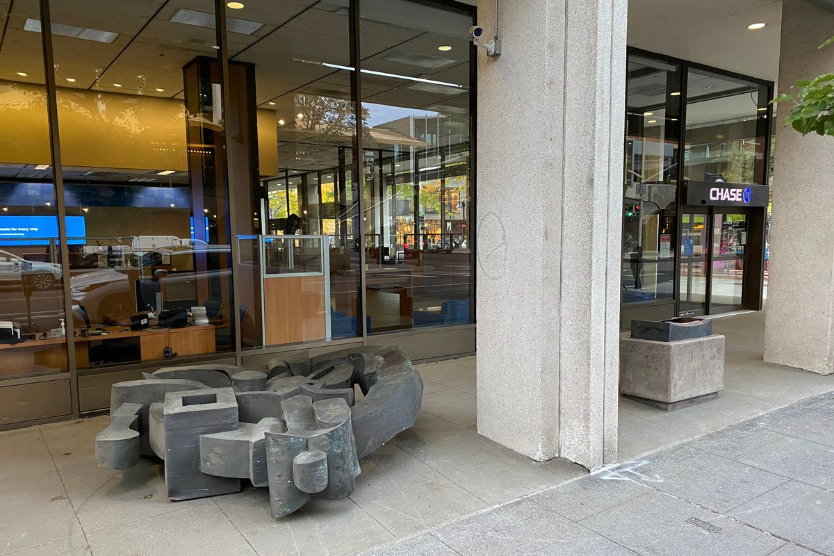 A Harold Balazs art culture was found lying on its side and removed from its pedestal outside Chase Bank downtown Friday.    (James Hanlon)