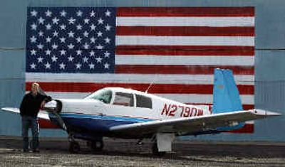 
Denver Wilkinson stands next to the plane he's flying around the country. 
 (Photo courtesy of Denver Wilkinson / The Spokesman-Review)