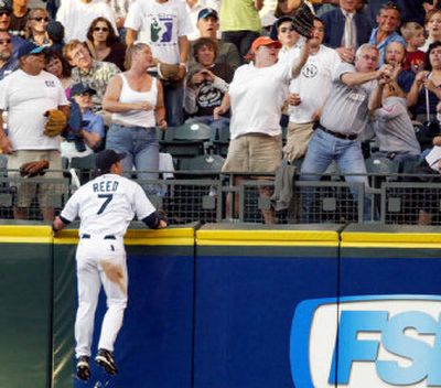 
Seattle center fielder Jeremy Reed could only watch Sal Fasano's fifth-inning homer land in the stands as Baltimore defeated the Mariners Thursday night at Safeco Field. 
 (Associated Press / The Spokesman-Review)
