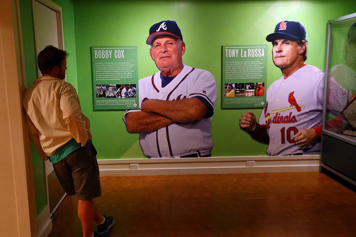 Fan looks at Hall of Fame display for Braves’ Bobby Cox. (Associated Press)