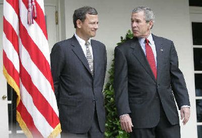 
President Bush, right, stands alongside his nominee for the Supreme Court,  John G. Roberts Jr. 
 (Associated Press / The Spokesman-Review)