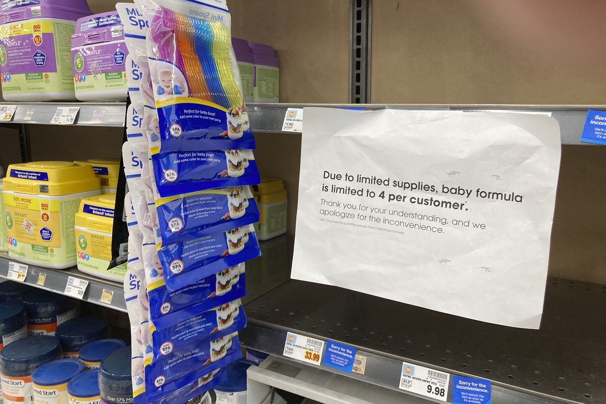 A sign telling consumers of limits on the purchase of baby formula hangs on the edge of an empty shelf for the product in a King Soopers grocery store, Wednesday, May 11, 2022, in southeast Denver. Parents across the country are struggling to find baby formula in stock in stores because of supply chain disruptions combined with a massive safety recall.  (David Zalubowski)