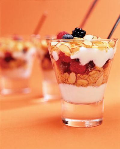
Yogurt layered with sliced fresh fruit and granola in tall clear glasses makes a festive breakfast or snack parfait. Associated Press
 (File Associated Press / The Spokesman-Review)
