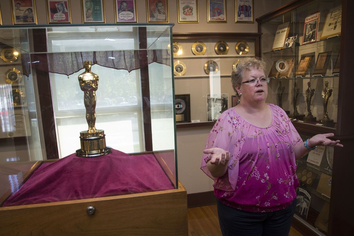 In the Crosby House on the Gonzaga University campus, at 508 E. Sharp Ave., Crosby curator Stephanie Plowman, explains the history of the Best Actor Oscar Bing Crosby won in 1945 for the movie “Going My Way.” On July 20, Plowman will discuss Crosby’s education as part of Sundays at the Crosby House, running through September. (COLIN MULVANY/The Spokesman-Review)