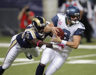 St. Louis Rams defensive end George Selvie (90) sacks Seattle Seahawks quarterback Matt Hasselbeck (8) during the second quarter of an NFL football game Sunday, Oct. 3, 2010, in St. Louis. (Tom Gannam / Fr45452 Ap)