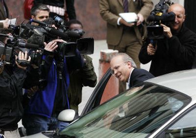 
White House aide Karl Rove, center, leaves the federal courthouse in Washington on Wednesday after making his fifth grand jury appearance in the Valerie Plame affair. 
 (Associated Press / The Spokesman-Review)