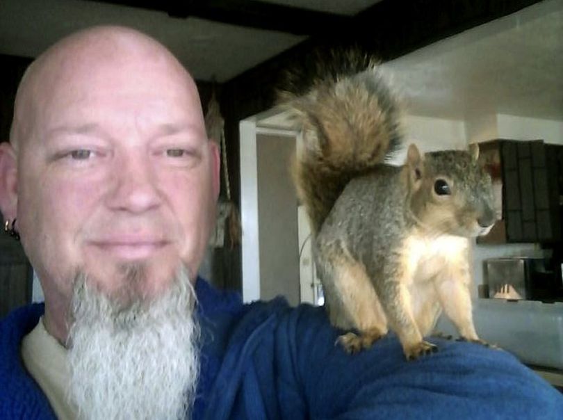 This undated photo provided by Adam Pearl shows Pearl with his pet squirrel Joey in Meridian, Idaho. (AP / Adam Pearl)