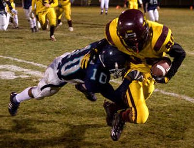 
Lake City's Sean Jackson (10) makes a tackle on Moses Lake's Billy Brice in the second quarter.The Spokesman Review
 (BRUCE TWITCHELL The Spokesman Review / The Spokesman-Review)