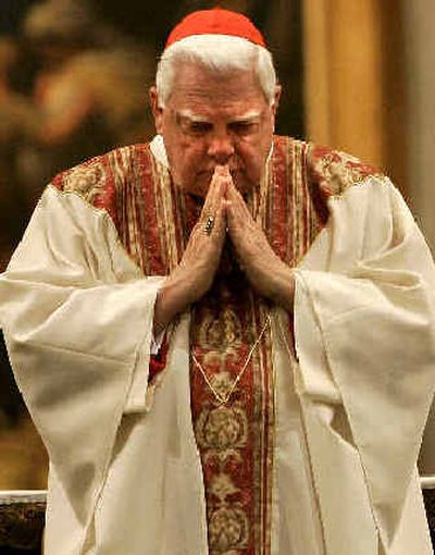 
U.S. Cardinal Bernard Law prays during a Mass at the St. Mary Major Basilica in Rome on Sunday. 
 (Associated Press / The Spokesman-Review)