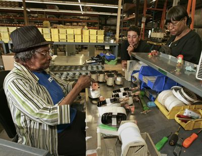 Ruby S. Johnson, 93, left,  with co-workers Noel Luciano, center, and Pauline Reynolds  in July. Johnson  has worked full time since 1951. Milwaukee Journal Sentinel (Milwaukee Journal Sentinel / The Spokesman-Review)