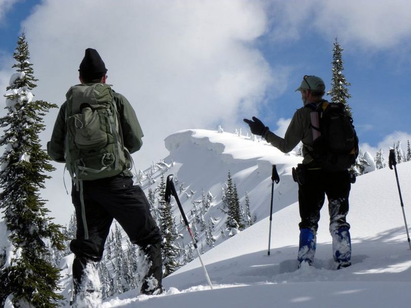 Big cornices, deep snow and a lot of avalanche danger still to come were found recently by Jim Mellen, right, and other Friends of the Scotchman Peaks Wilderness as they used backcountry skis to carefully explore the Goat Mountain area northeast of Lake Pend Oreille recently. (Andrew Klaus / Friends of the Scotchman Peaks Wilderness)