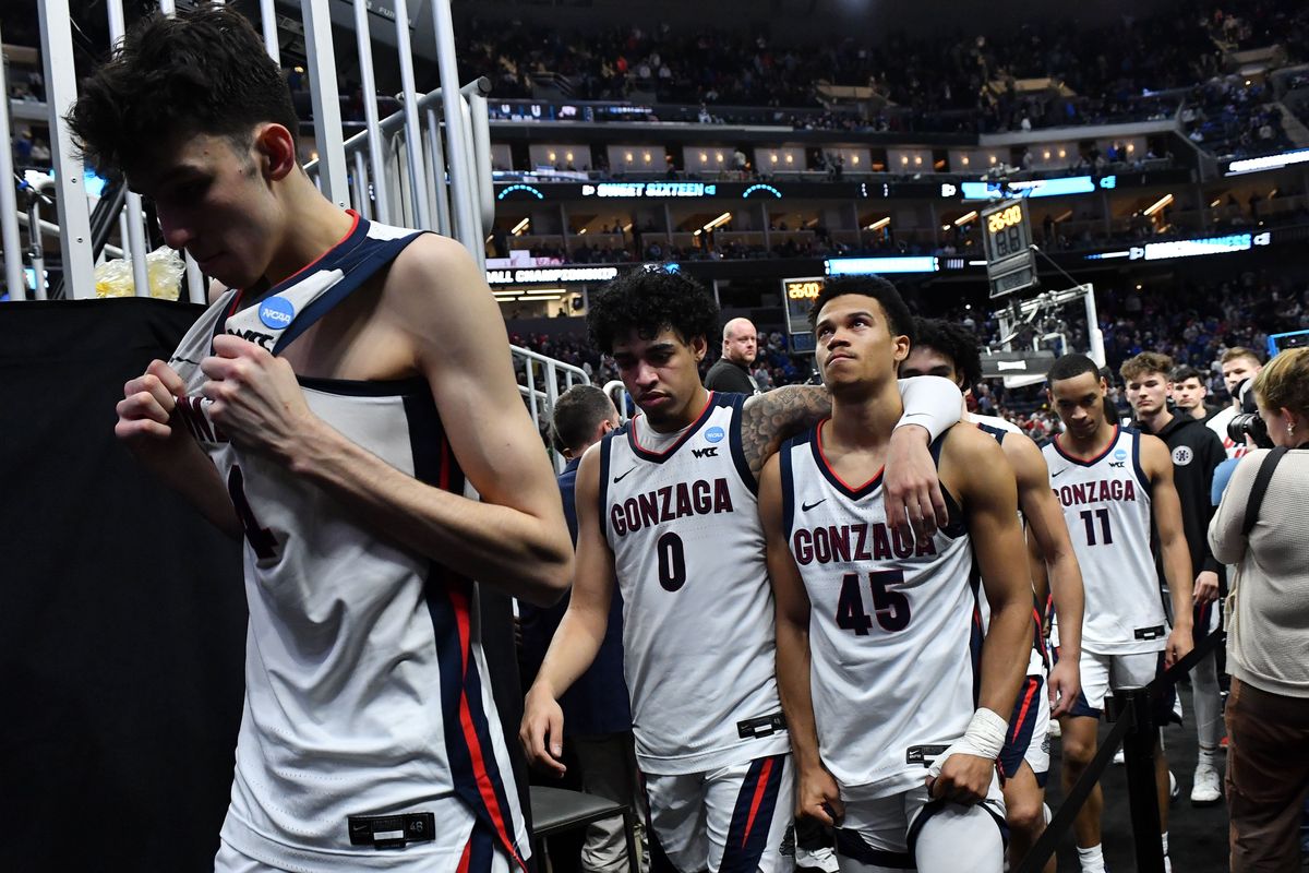 Gonzaga Bulldogs center Chet Holmgren (34), guard Julian Strawther (0) and guard Rasir Bolton (45) head to the locker room after falling to the Arkansas Razorbacks during the second half of a Sweet 16 game on Thursday Mar 24, 2022, at Chase Center in San Francisco, Calif. The Arkansas Razorbacks won the game 74-68.  (Tyler Tjomsland/The Spokesman-Review)