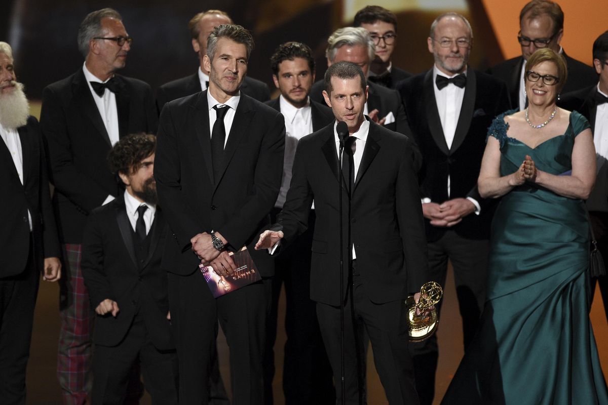 David Benioff, center left, and D.B. Weiss accept the award for outstanding drama series for "Game Of Thrones" at the 71st Primetime Emmy Awards on Sunday, Sept. 22, 2019, at the Microsoft Theater in Los Angeles. (Chris Pizzello / Associated Press)