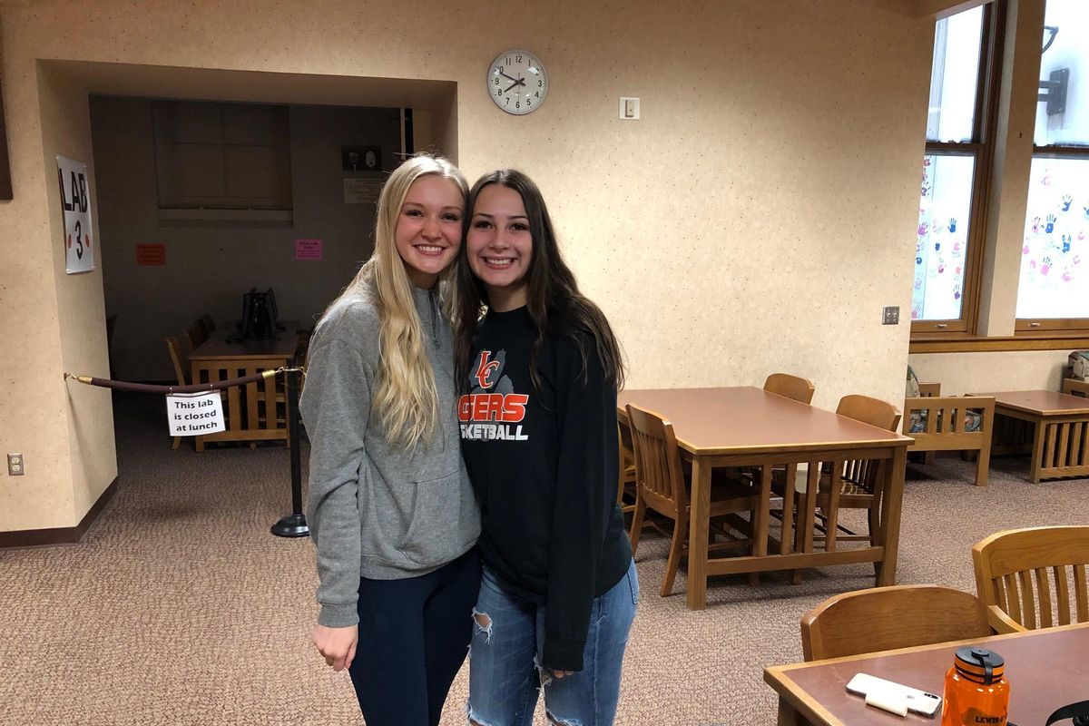 Basketball players Kaylee Bishop, left, and Dominique Arquette pose after signing their National Letters of Intent on Wednesday  at the Lewis and Clark library. Bishop is headed to George Fox while Arquette signed with Eastern Arizona. (Dave Nichols / The Spokesman-Review)
