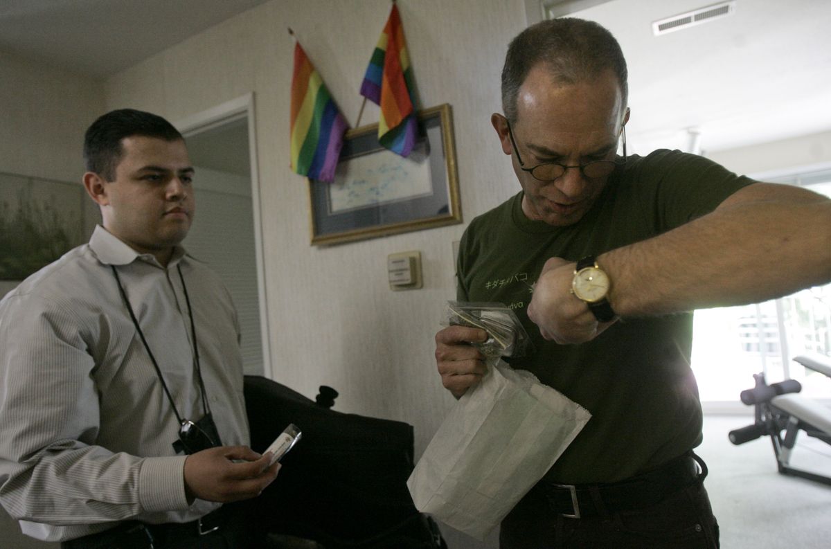 Erick Alvaro, left, delivers medical marijuana from the Green Door dispensary to the San Francisco home of a man who wished to be identified only as David on May 20. Associated Press photos (Associated Press photos / The Spokesman-Review)