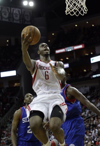 Houston Rockets' Terrence Jones drives past the Philadelphia 76ers on his way to two of his 20 points on Thursday. (Associated Press)