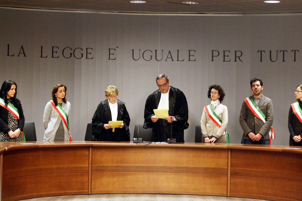 Appeals Court Judge Alessandro Nencini, center, reads out the verdict for the murder of British student Meredith Kercher, in Florence, Italy, Thursday. (Associated Press)