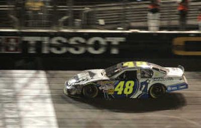 
Jimmie Johnson crosses the finish line to win the Sharp Aquos 500 Sunday. Associated Press
 (Associated Press / The Spokesman-Review)