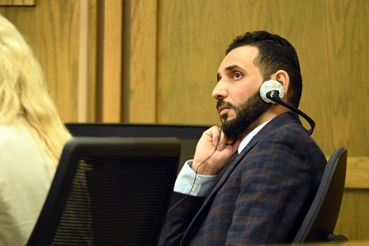Yasir Darraji listens to the audio of a translator on the first day of his second-degree murder trial on Nov. 2 in Spokane County Superior Court. Darraji is accused of killing his ex-wife, Ibtihal Darraji, who was found strangled in a burning car in January 2020.  (Jesse Tinsley/THE SPOKESMAN-REVI)