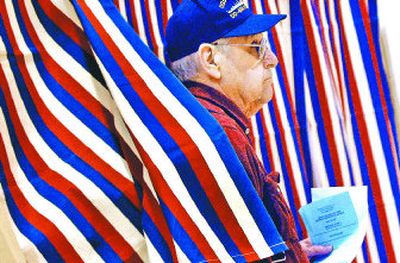 
Coeur d'Alene resident Carl Zehner leaves the voting booth at Ramsey Elementary on Tuesday after voting on the school levy election in Coeur d'Alene. 
 (Photos by KATHY PLONKA / The Spokesman-Review)