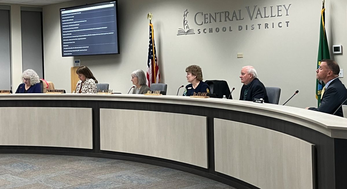 Left to right, Central Valley school board members Cindy McMullen, Pam Orebaugh, Teresa Landa, Debra Long and Keith Clark and Superintendent John Parker listen to a high school student address the board with a school update at a Nov. 13 School Board meeting.  (Elena Perry/The Spokesman-Review)