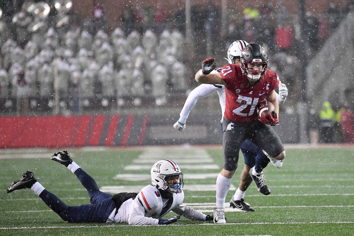 Washington State Cougars running back Max Borghi (21) breaks a tackle and runs the ball for a touchdown agianst the Arizona Wildcats during the first half of a college football game on Friday, Nov 19, 2021, at Martin Stadium in Pullman, Wash.  (Tyler Tjomsland/The Spokesman-Review)