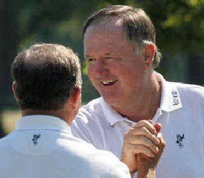 
Allen Doyle, right, receives a victory shake.
 (Associated Press / The Spokesman-Review)