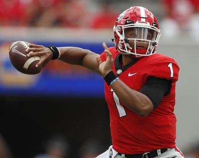 Georgia quarterback Justin Fields (1) throws a pass against Middle Tennessee in September. Fields, the overall No. 2 national prospect in the 2018 recruiting class, announced he will transfer to Ohio State. (John Bazemore / Associated Press)