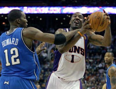 
Phoenix Suns forward Amare Stoudemire, right, is fouled by Orlando Magic forward Dwight Howard. Associated Press
 (Associated Press / The Spokesman-Review)