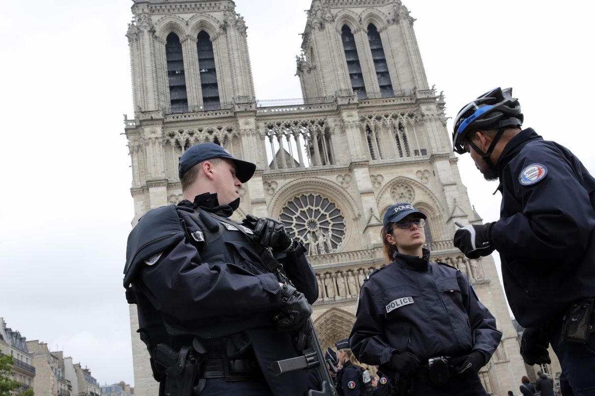 French police officers patrol outside Notre Dame Cathedral in this Sunday, May 7, 2017, file photo in Paris. (Burhan Ozbilici / Associated Press)