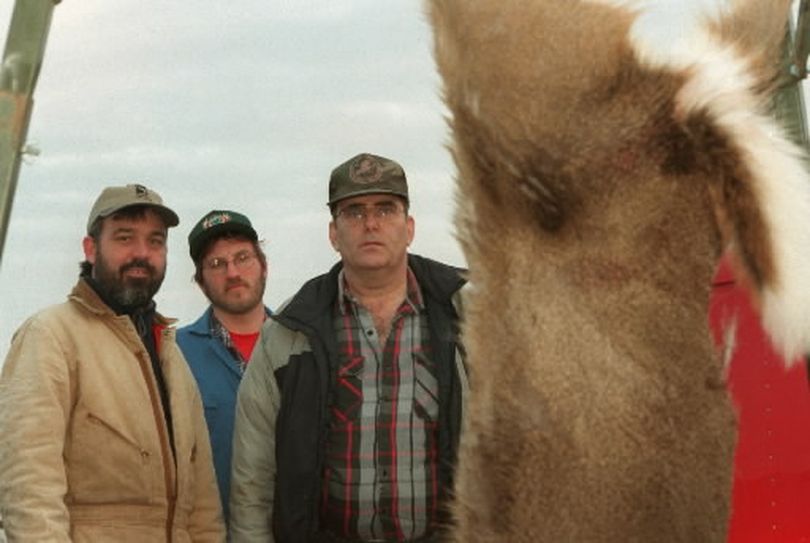 Members of the Inland Northwest Wildlife Council's Wildlife recovery team bringing in a roadkill white-tailed deer to salvage meat for the needy. (Rich Landers)