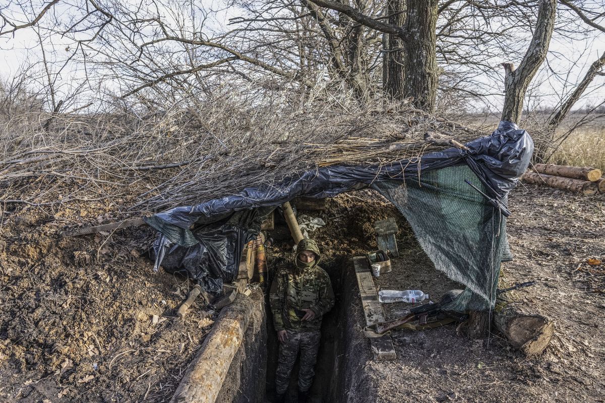 A Ukrainian soldier in the entrance to a bunker at a military position in the Zaporizhzhia region on Nov. 30. MUST CREDIT: Photo for The Washington Post by Heidi Levine.  (Heidi Levine/For The Washington Post)