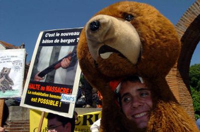 
A man wears an imitation bear- skin during a demonstration in Toulouse, France, on Saturday. 
 (Associated Press / The Spokesman-Review)