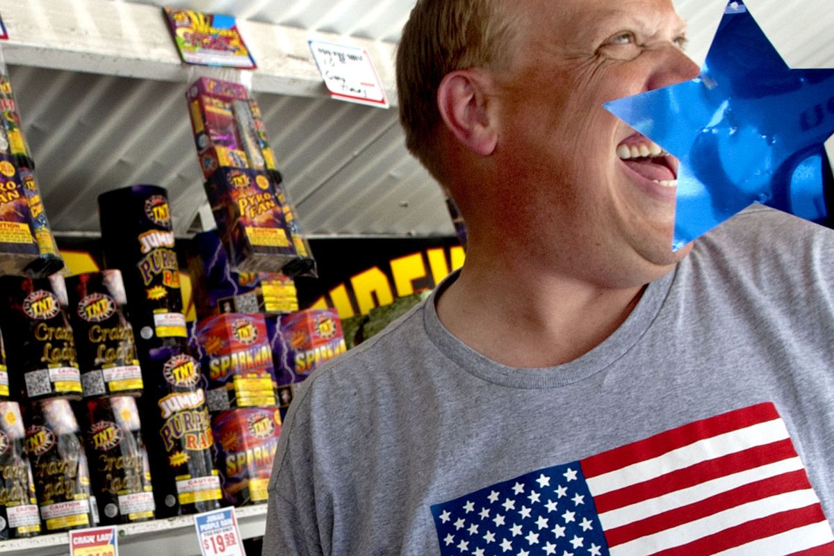 Troy Carpenter of Journey Ministries shares a laugh as he sells fireworks as a fundraiser for the Hayden church in Coeur d’Alene on Tuesday. (Kathy Plonka)