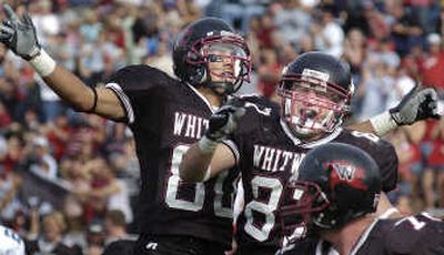 
Whitworth receivers Steve Silva, left, and Andy Largent, center, celebrate a TD reception against Wisconsin-Stout. 
 (Christopher Anderson / The Spokesman-Review)