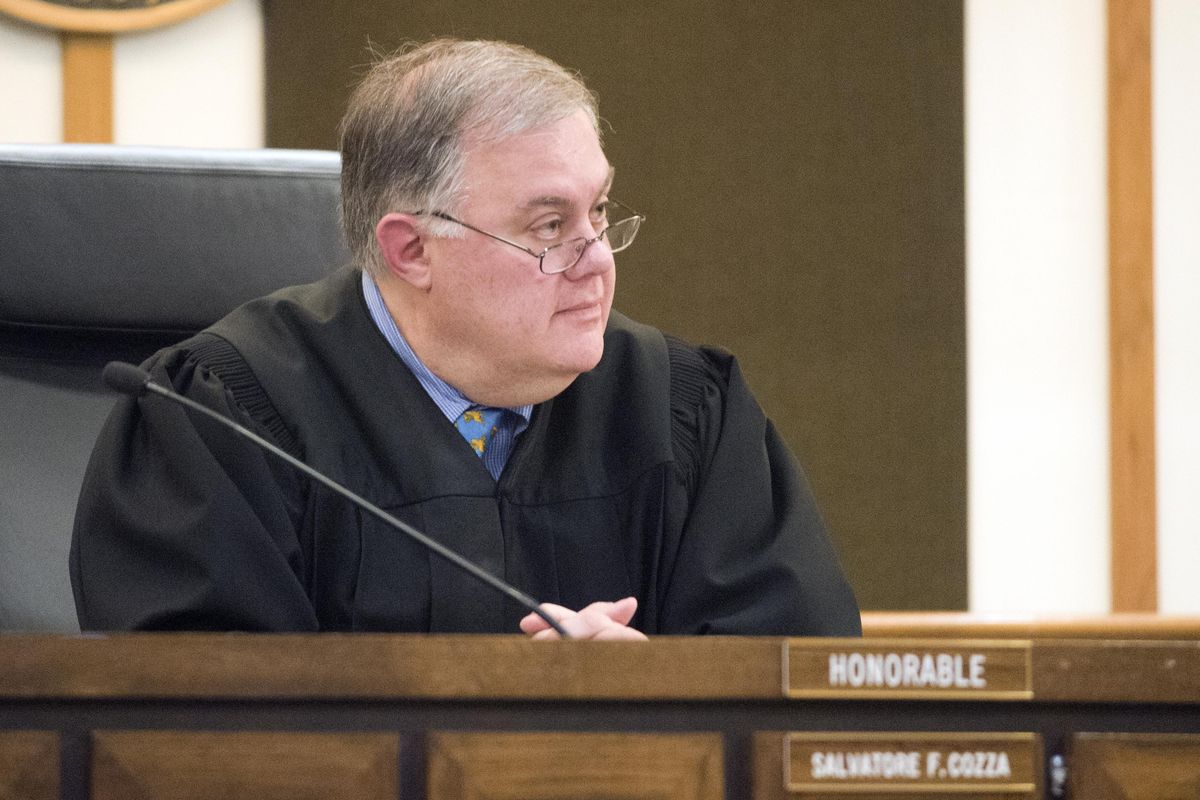In this Jan. 7, 2015, file photo, Spokane Superior Court Judge Sam Cozza questions Kenan Adams Kinard in a Spokane courtroom before Kinard pleaded guilty in the murder of Delbert Belton. (Jesse Tinsley / The Spokesman-Review)