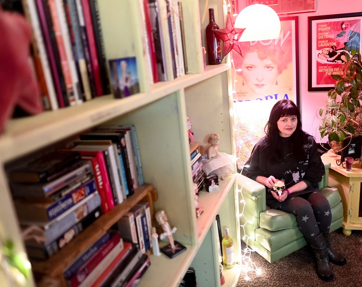 Heather Clarke poses for a photo with her rarest Marilyn Monroe Funko Pop figurine as she shows some of her Marilyn Monroe memorabilia on Feb. 1 at her home in Spokane.  (Tyler Tjomsland/The Spokesman-Review)