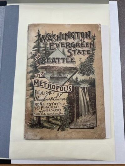 An original copy of “Washington the Evergreen State and Seattle its Metropolis,” the booklet credited as the origin of Washington’s unofficial nickname, is pictured.  (Elena Perry/THE SPOKESMAN-REVIEW)