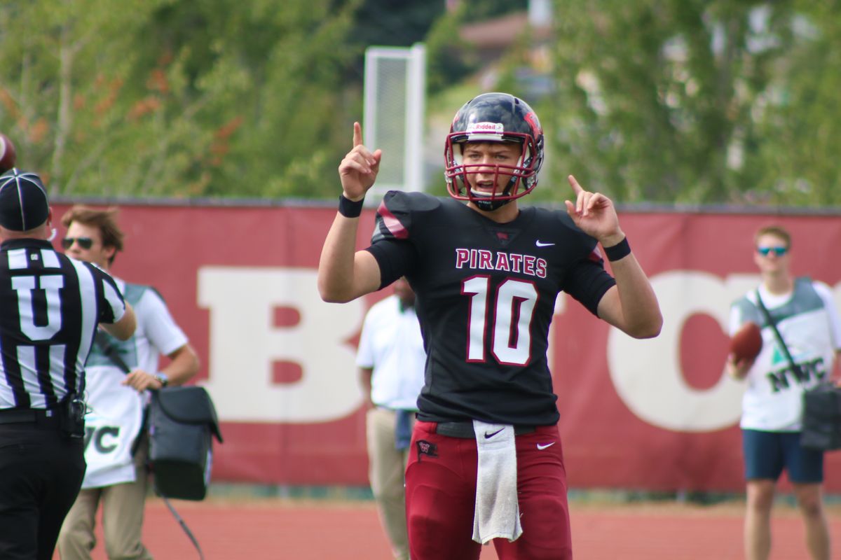 Whitworth quarterback Caleb Christensen motions to the sideline during the Pirates