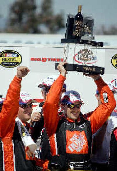 
Tony Stewart, right, celebrates after winning. 
 (Associated Press / The Spokesman-Review)