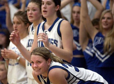 
 Jenna DeLong, bottom, smiles at the Vikings' impending victory as final seconds tick away. 
 (Tom Davenport / / The Spokesman-Review)