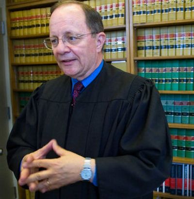 District Court Judge Mike Padden prepared to hold court in the Public Safety Building in 2006 after announcing he would not seek re-election. 
 (FILE / The Spokesman-Review)